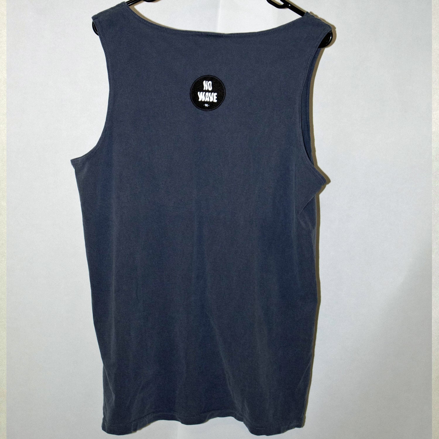 The 'BIRTHDAY PARTY' Tank Top Shirt (Fried Navy Blue in color) is sure to beat the heat this summer while layin' the vibe out pretty clearly:  Let's flippin' party!  This stylish, soft, and comfy Tank Top Shirt is slightly wider than your ordinary tee; it's a loose fit and extremely comfy on those hot summer days.  In length, it runs similar to a normal T Shirt, if anything 1/2" shorter.  It's got that 90's tank style going strong! Designed by No Wave NC