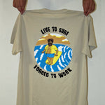 Load image into Gallery viewer, &#39;Live to Surf, Forced to Work!&#39;.....whether you like attention or not, when you&#39;re rockin&#39; this Tee, you can count on gettin&#39; a few &quot;I feel ya brotha&quot;s.  Because if you have ever ridden a wave before, you&#39;ll most likely agree that there could be no truer saying on earth.  However, at No Wave NC, we are aware that each and every wave, every ride, is an incredibly special gift that&#39;ll only come one time.  Cherish that moment and enjoy the ride my friends!  Designed in Wrightsville Beach, NC by No Wave NC
