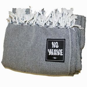 The new 'MARS' Surf Towel (in Dark Grey color) by No Wave NC is a classic.  Built using the traditional Turkish hand loom method which results in uber soft, lightweight, packable, absorbent, quick drying and durable towels!  Made using 100% natural cotton fibers and ink; eco-friendly and biodegradable.